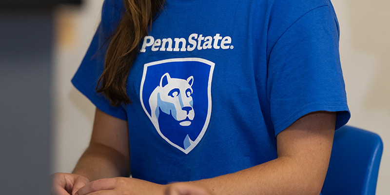 Vertical Penn State mark printed on the front of a T-shirt