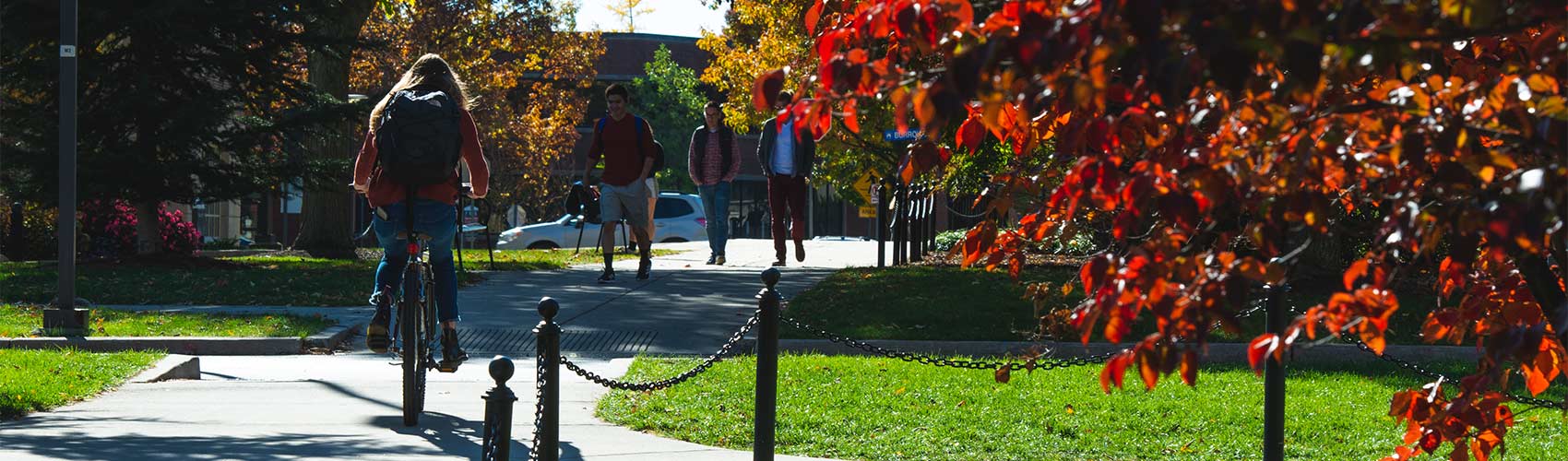 student biking on campus